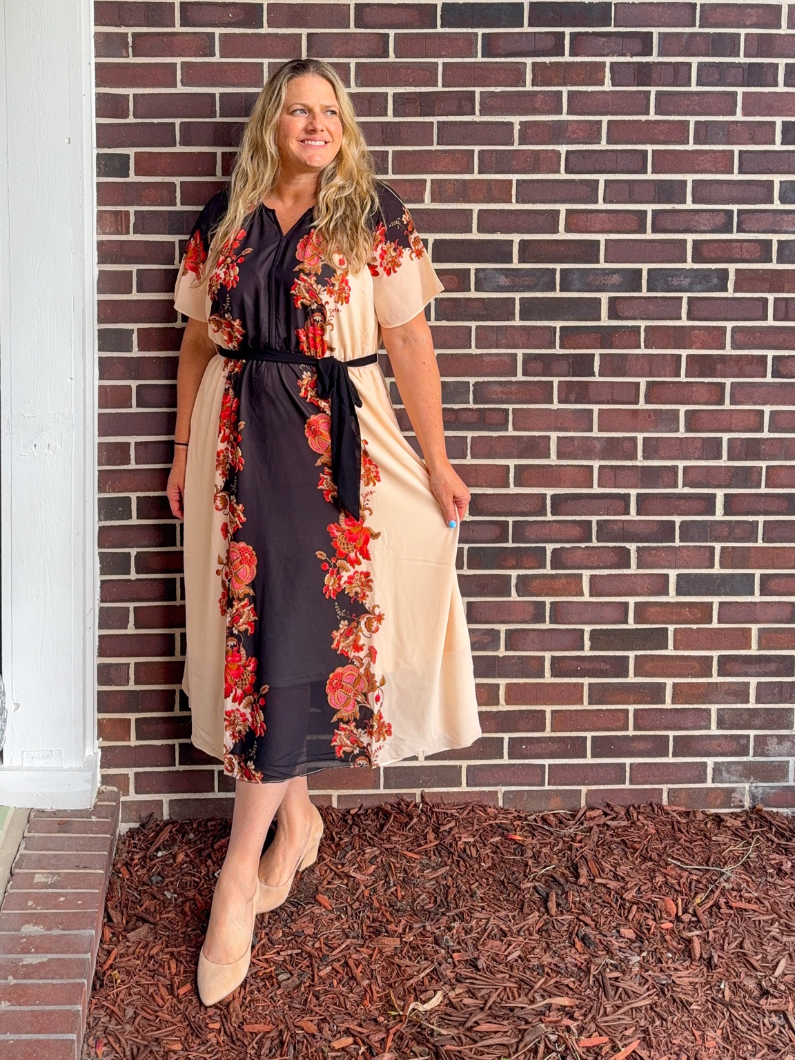 Jeni Betts wearing a floral dress
